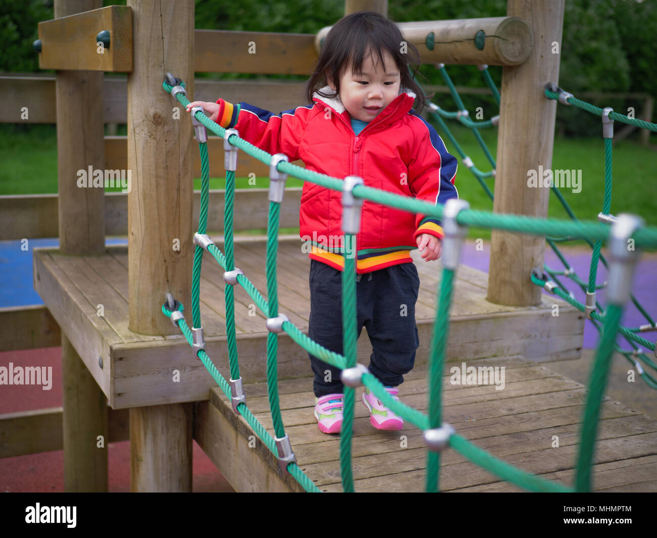 Baby girl play at outdoor playground Stock Photo