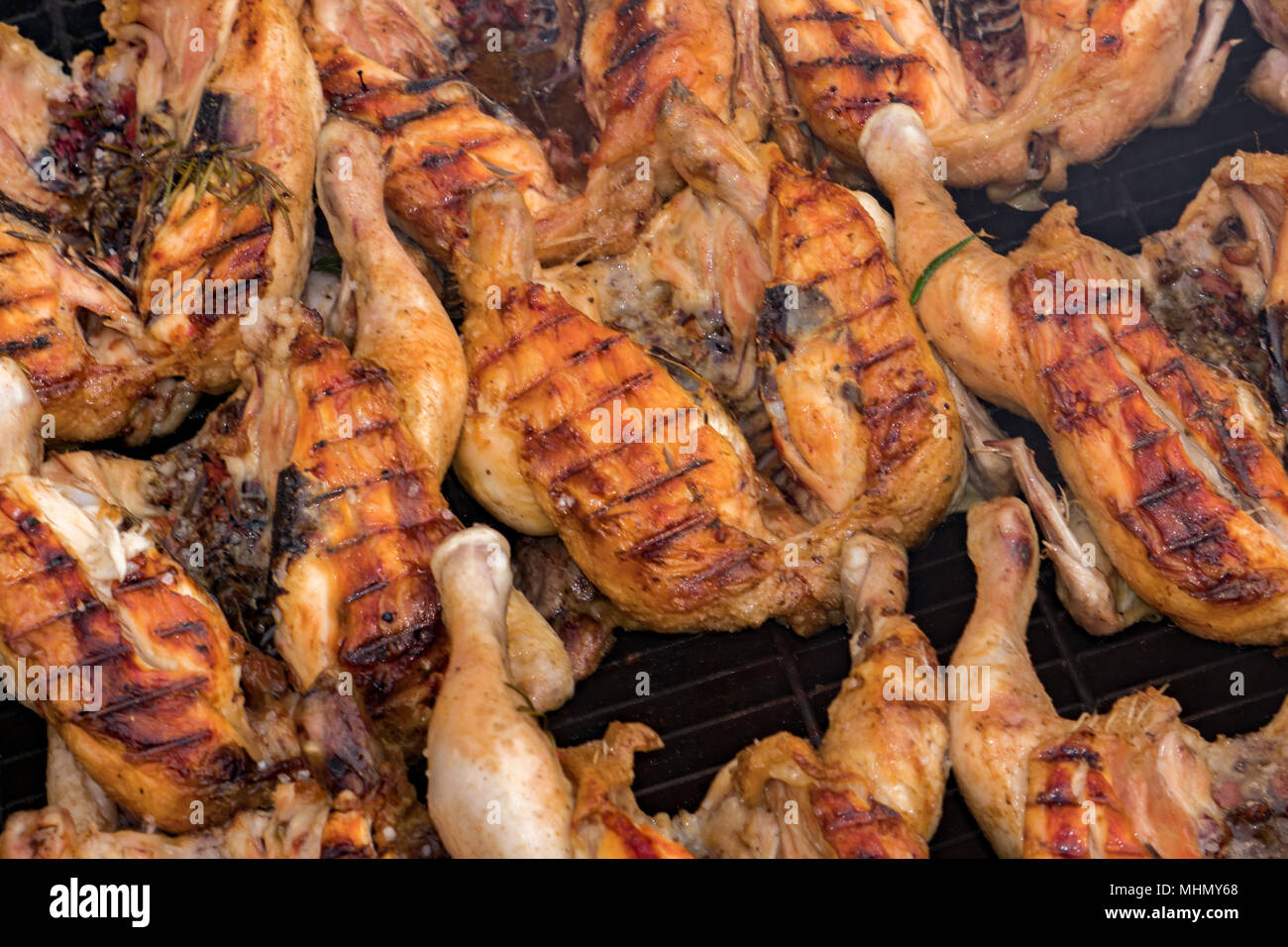 Many roasted chickens grilled at barbecue detail Stock Photo Alamy