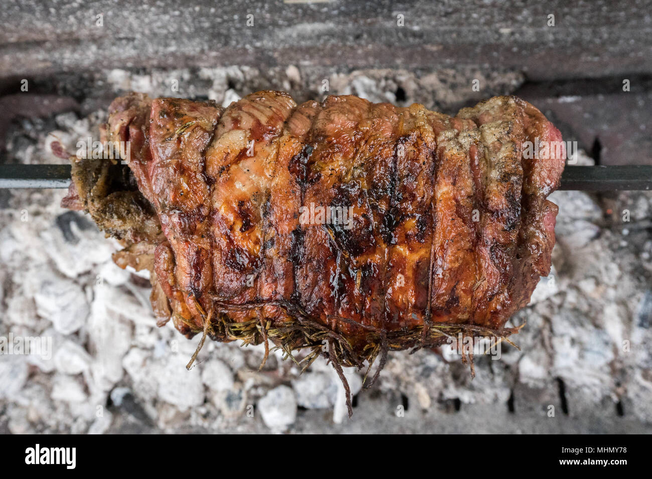 veal roast while cooking on charcoal barbecue grill Stock Photo Alamy