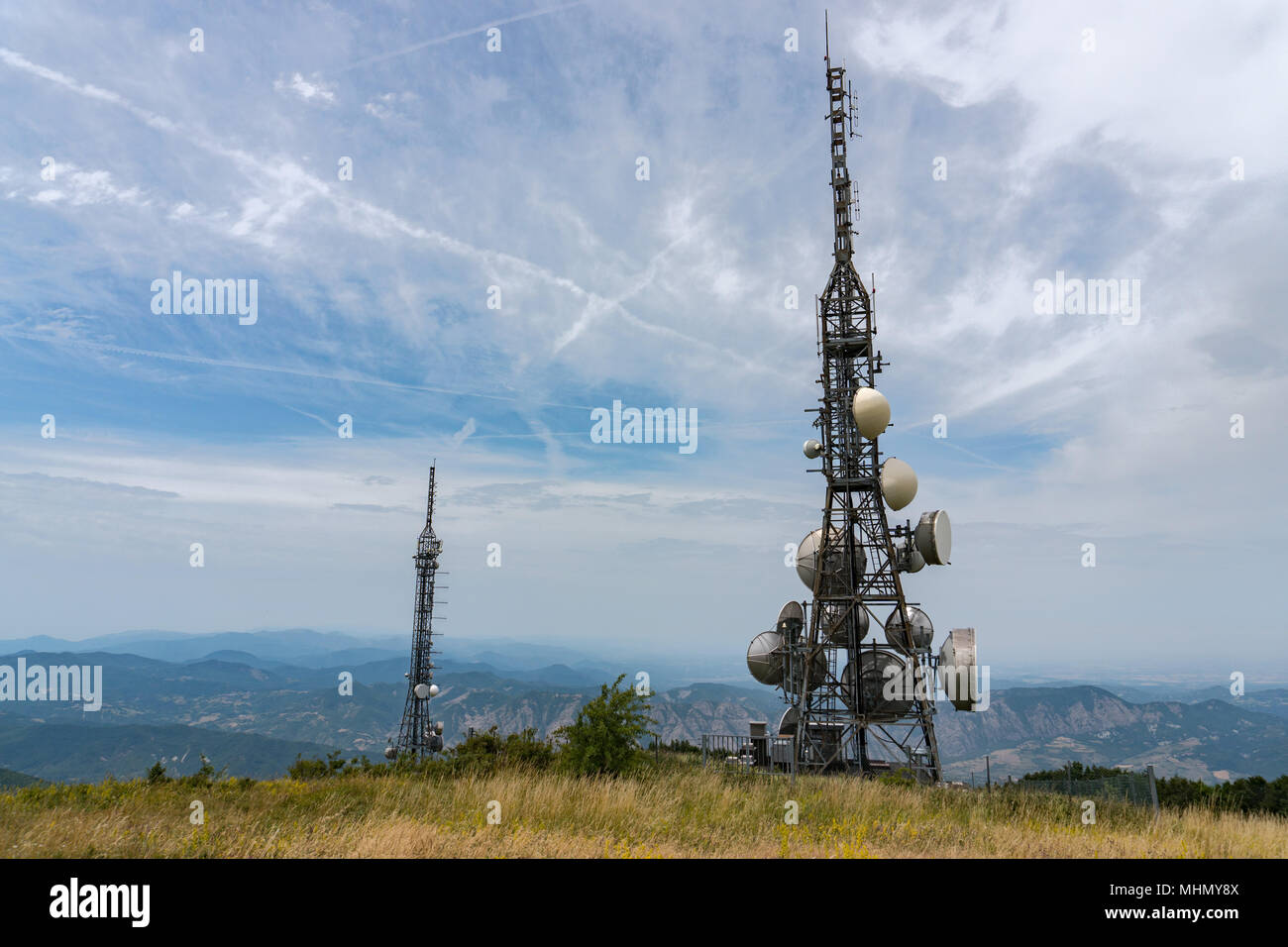 Communication Antenna on the light blue sky background Stock Photo - Alamy