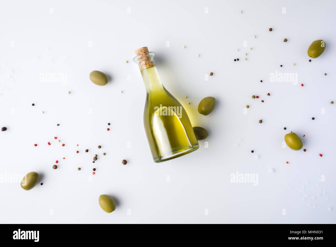olive oil bottle with cork and olives Stock Photo
