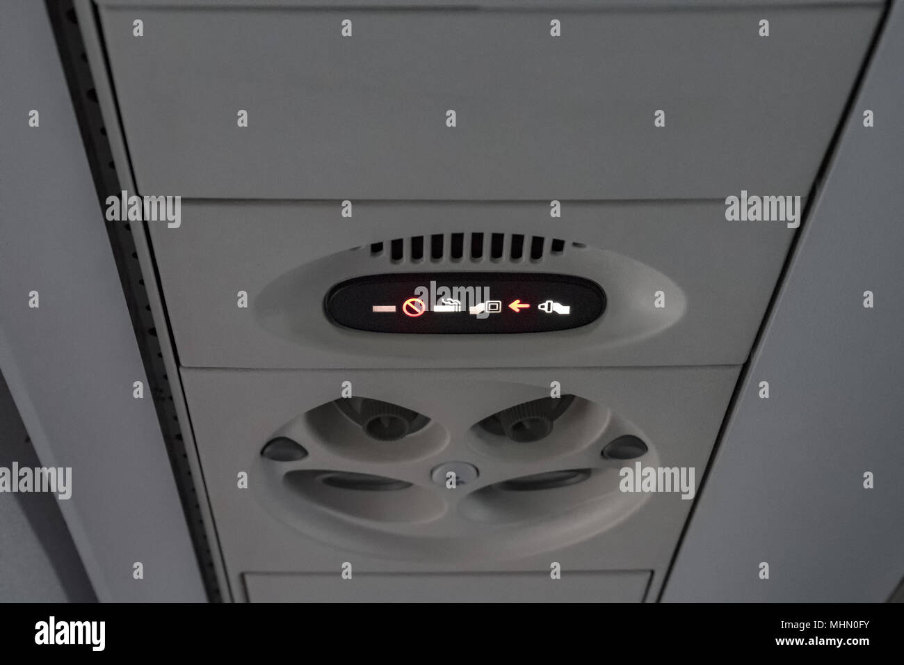 belt on sign on airplane detail Stock Photo Alamy