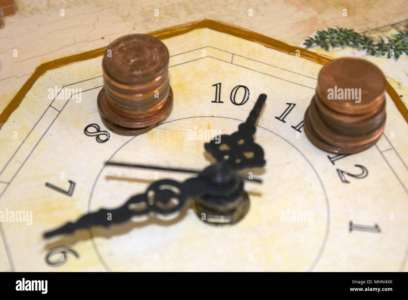 concept of time in business with a clock and some money Stock Photo