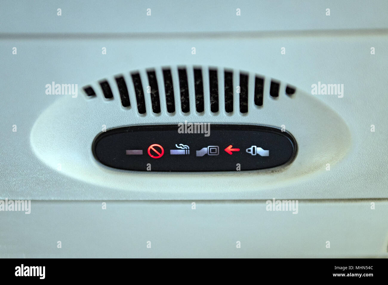 belt on sign on airplane detail Stock Photo Alamy