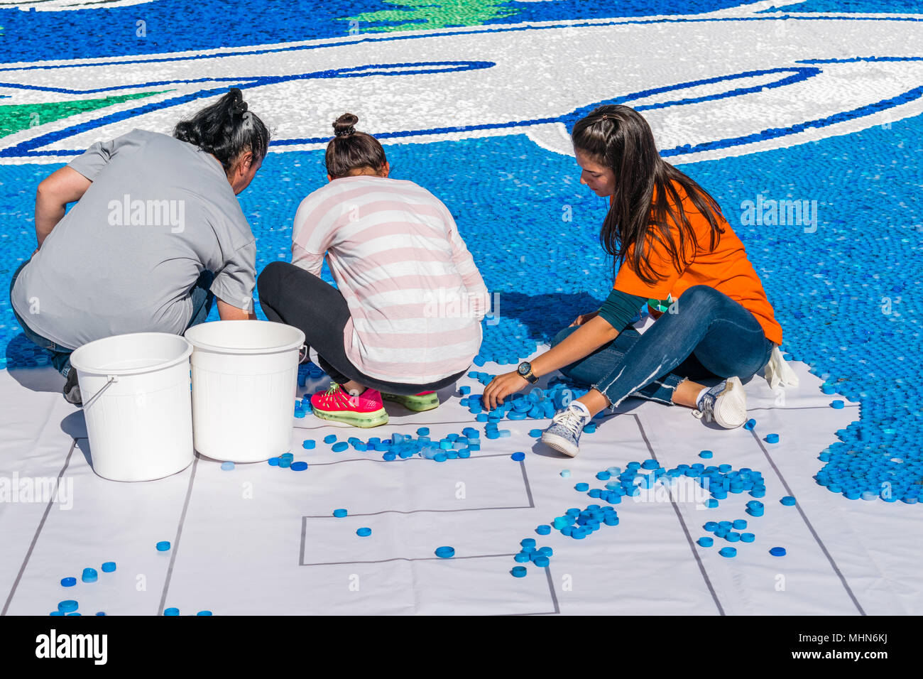 Volunteers assembling a mosaic out of plastic bottle caps, Novi Sad