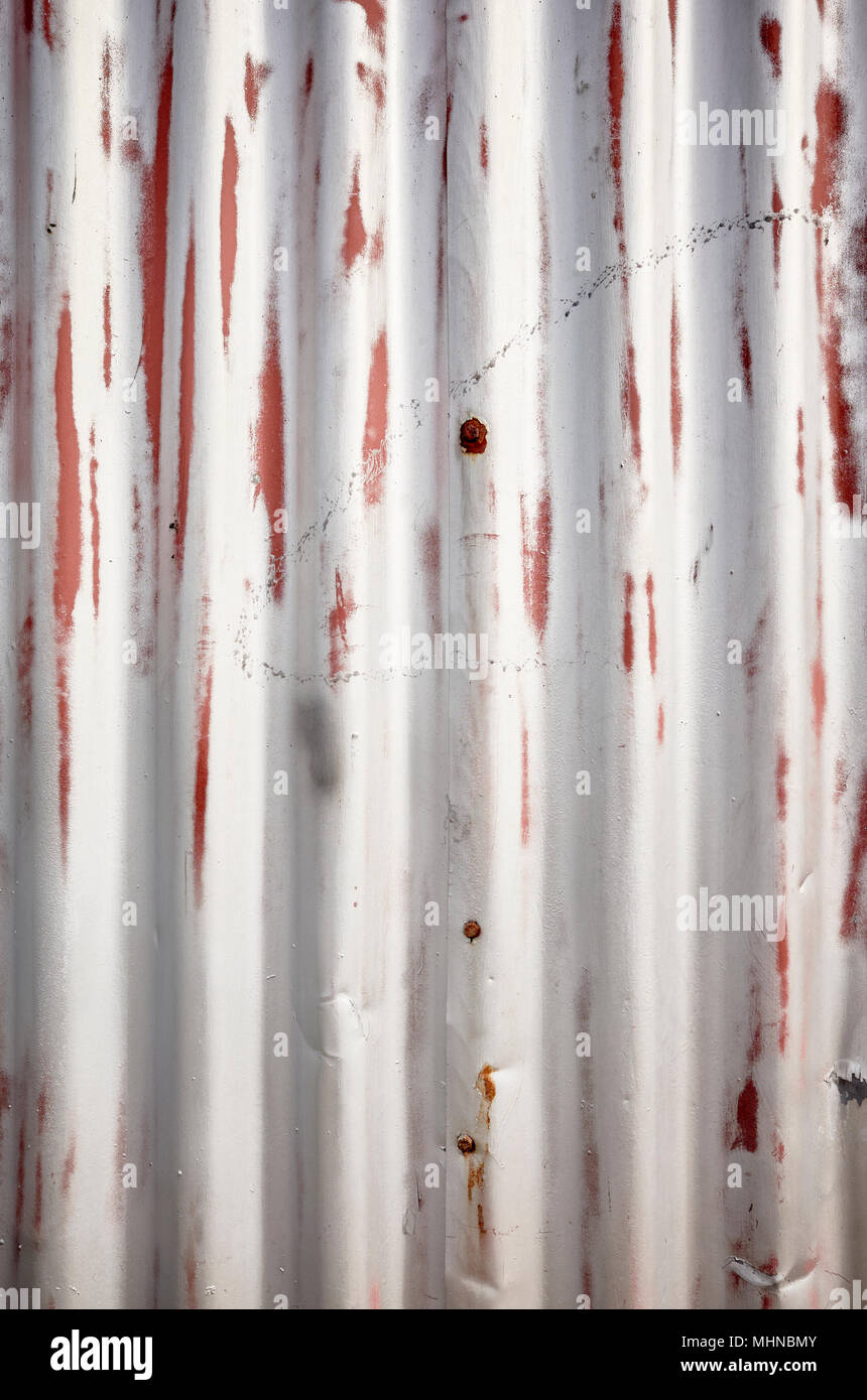 Weathered corrugated metal sheet, abstract background. Stock Photo