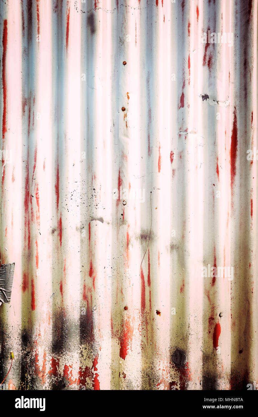 Weathered corrugated metal sheet, abstract background. Stock Photo