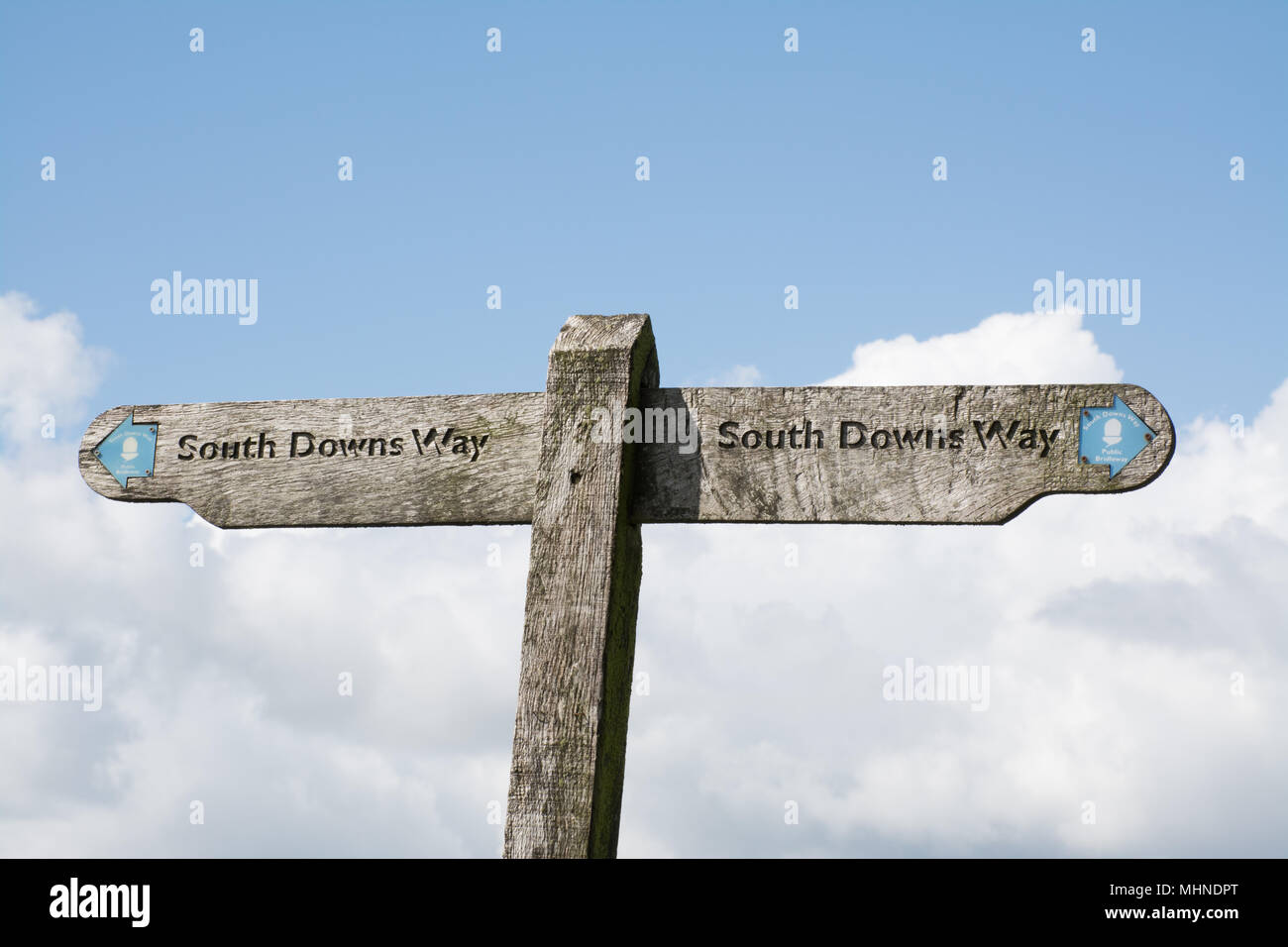 Wooden fingerpost sign pointing to the South Downs Way Stock Photo