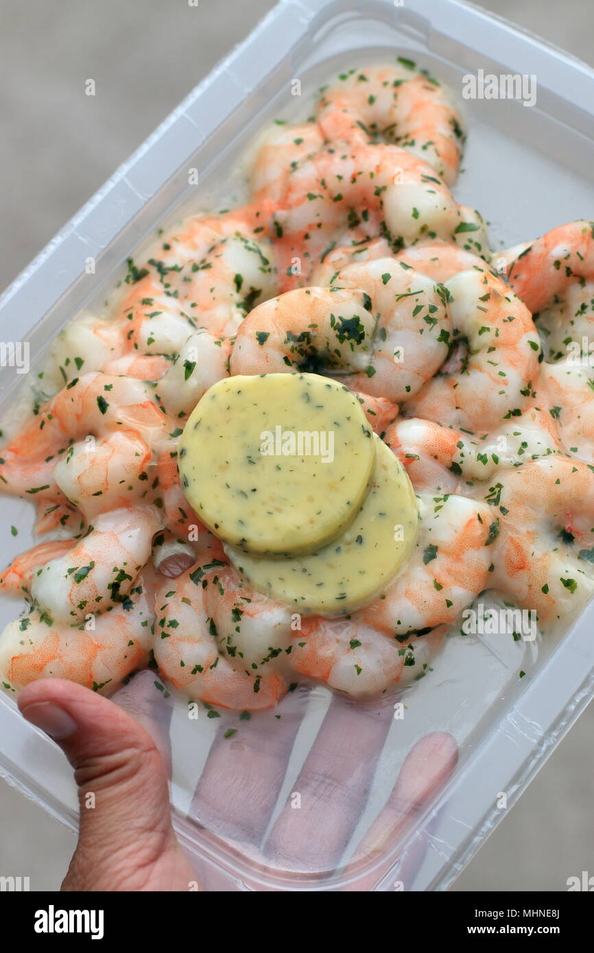 Peeled prawns with garlic butter Stock Photo