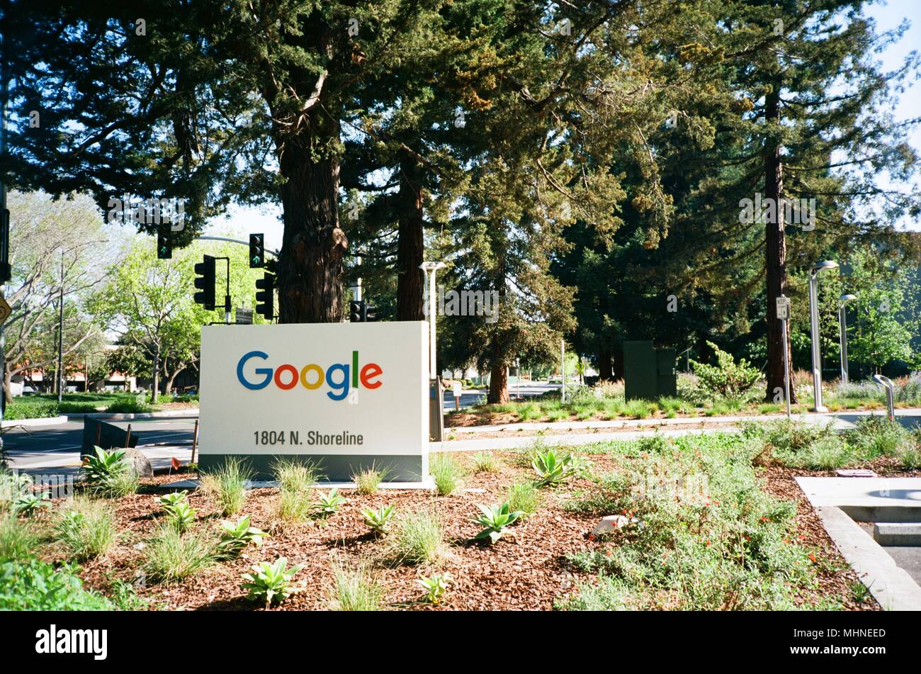 Sign with logo for Google Inc in a wooded area at the Googleplex, the ...