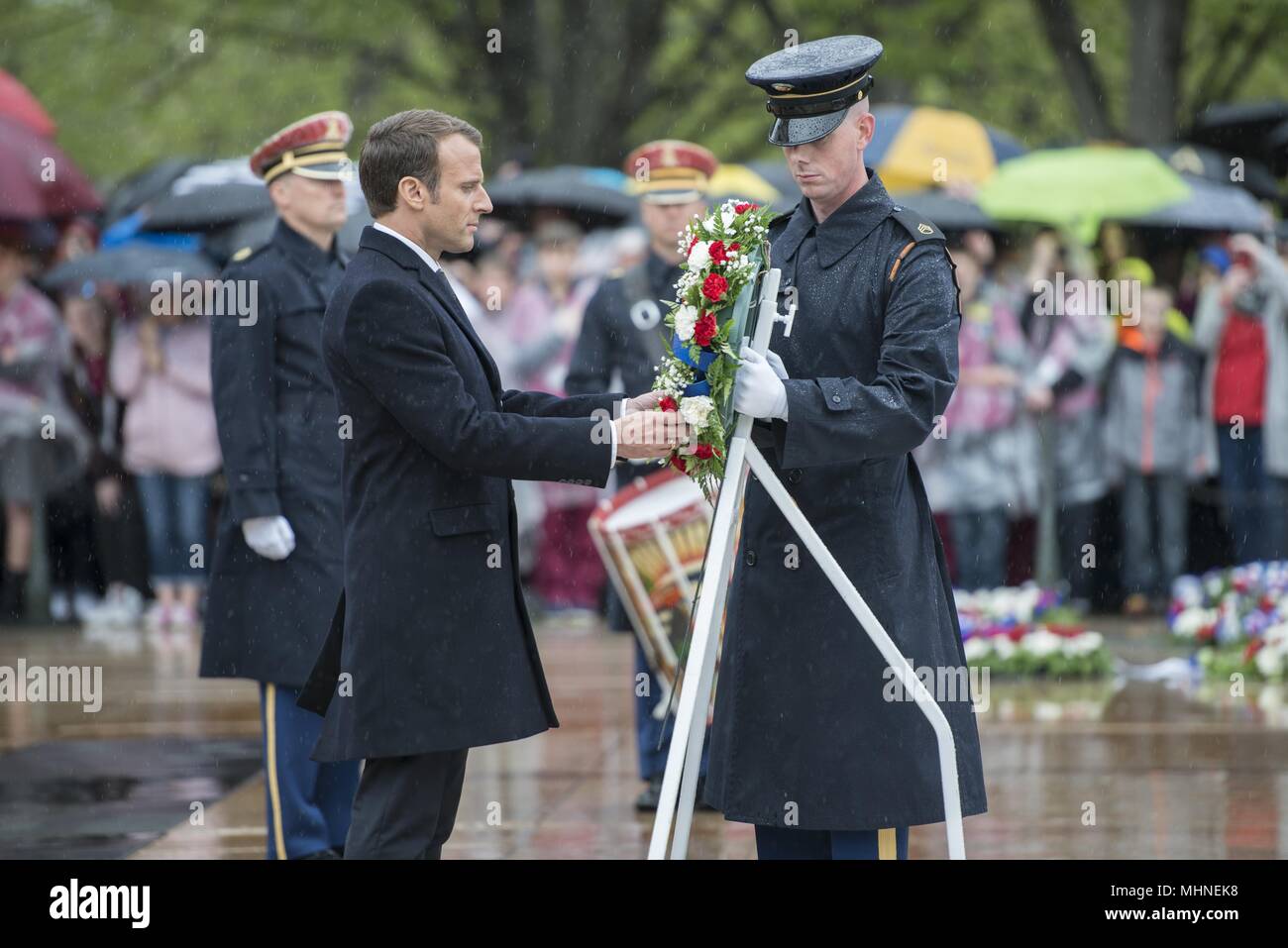 French President Emmanuel Macron participates in a wreath-laying ceremony at the Tomb of the Unknown Soldier at Arlington National Cemetery, Arlington, Virginia, April 24, 2018, April 24, 2018. President Macron's visit to Arlington National Cemetery was part of the first official State Visit from France since President Francois Hollande came to Washington in 2014. President Macron along with his wife, Brigitte Macron, also visited the gravesite of former President John F. Kennedy. (U.S. Army photo by Elizabeth Fraser / Arlington National Cemetery / released). () Stock Photo