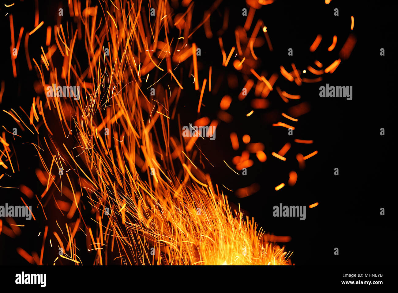 Close-up of sparks against black bakground. Stock Photo