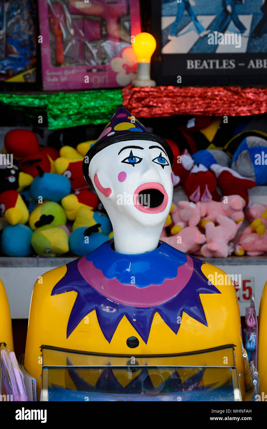 A clown with its mouth open at a funfair Stock Photo