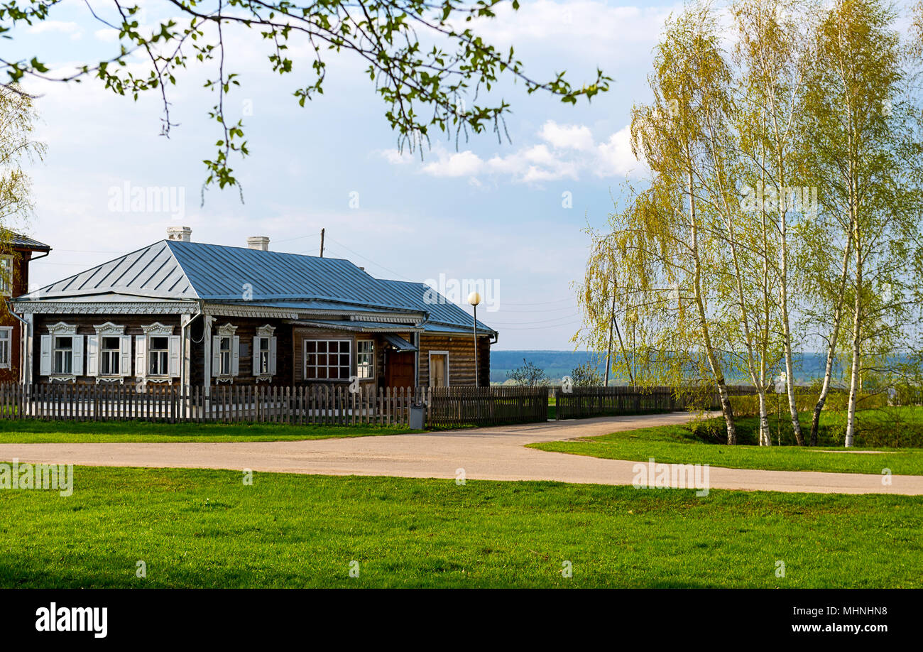 The small house with a fence in Russian village Stock Photo - Alamy