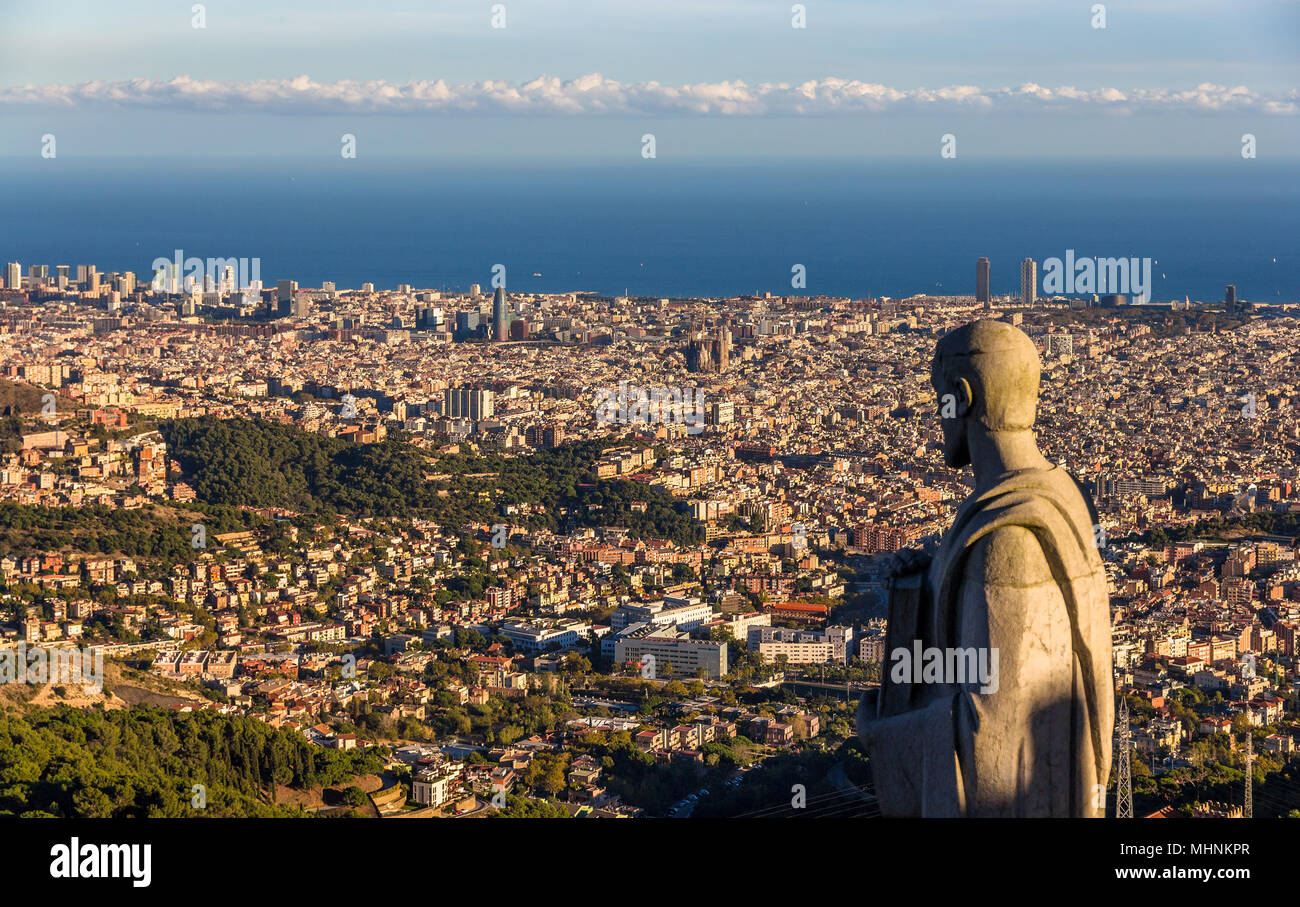 Sculpture of Apostle and view of Barcelona Stock Photo