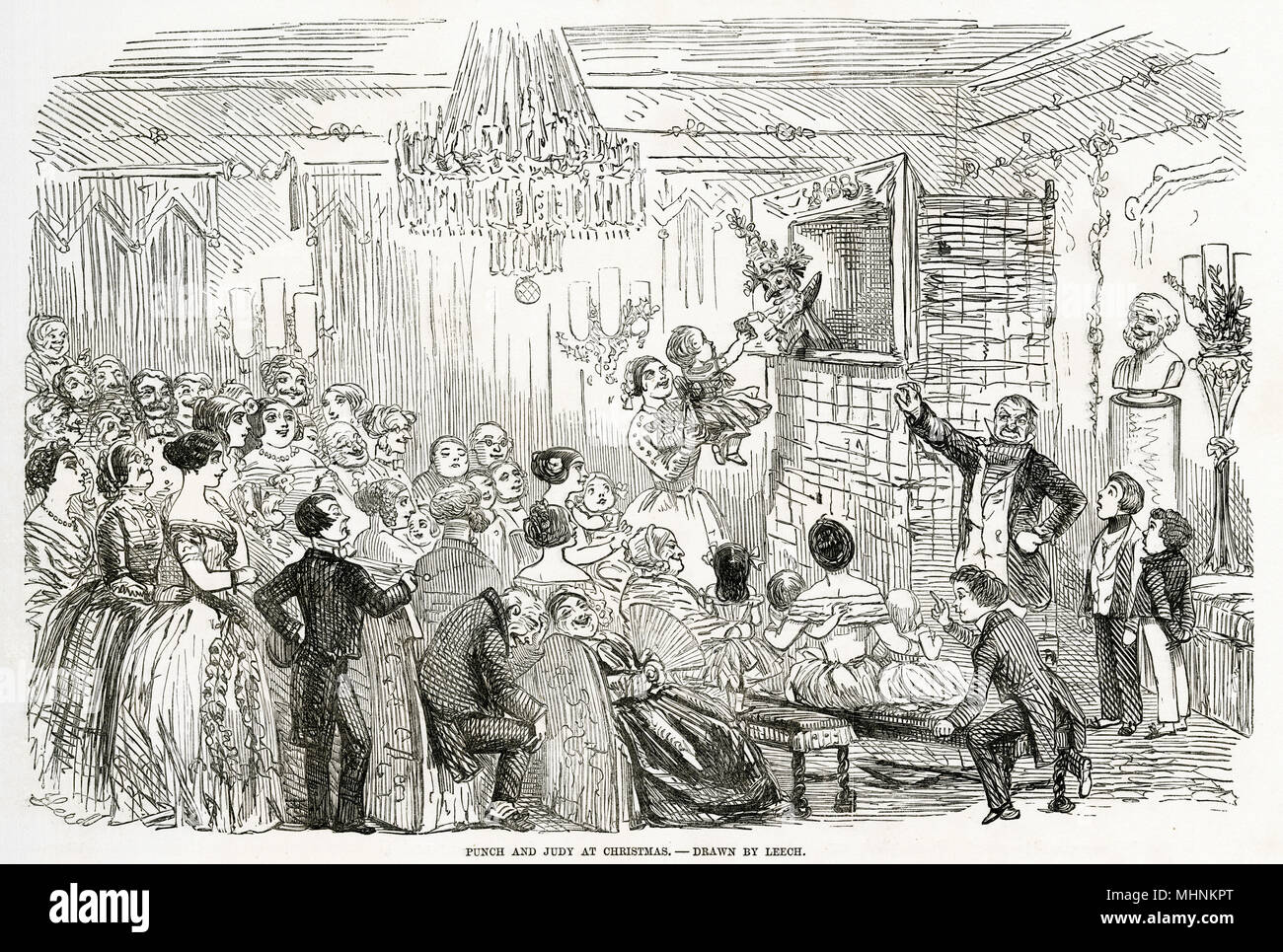 Children and adults alike watching 'Punch and Judy' at Christmas.     Date: 19th Century Stock Photo