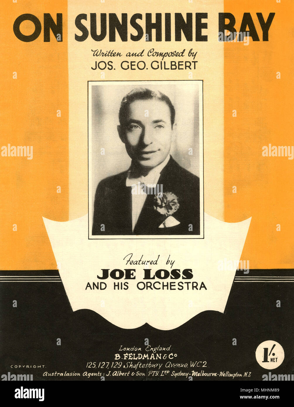 'On Sunshine Bay' - Music Sheet Cover written and composed by Jos. Geo. Gilbert, featured by Joe Loss and his orchestra. An illustration with an photo of Joe Loss in the middle.     Date: circa 1946 Stock Photo