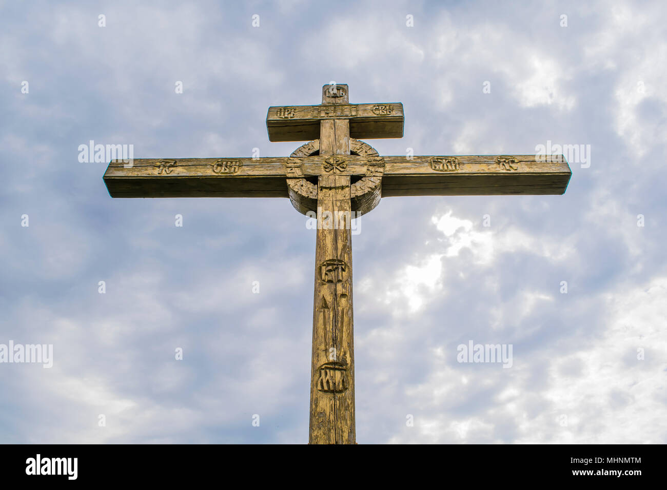 A wooden cross on top of a hill. Orthodox white Stock Photo