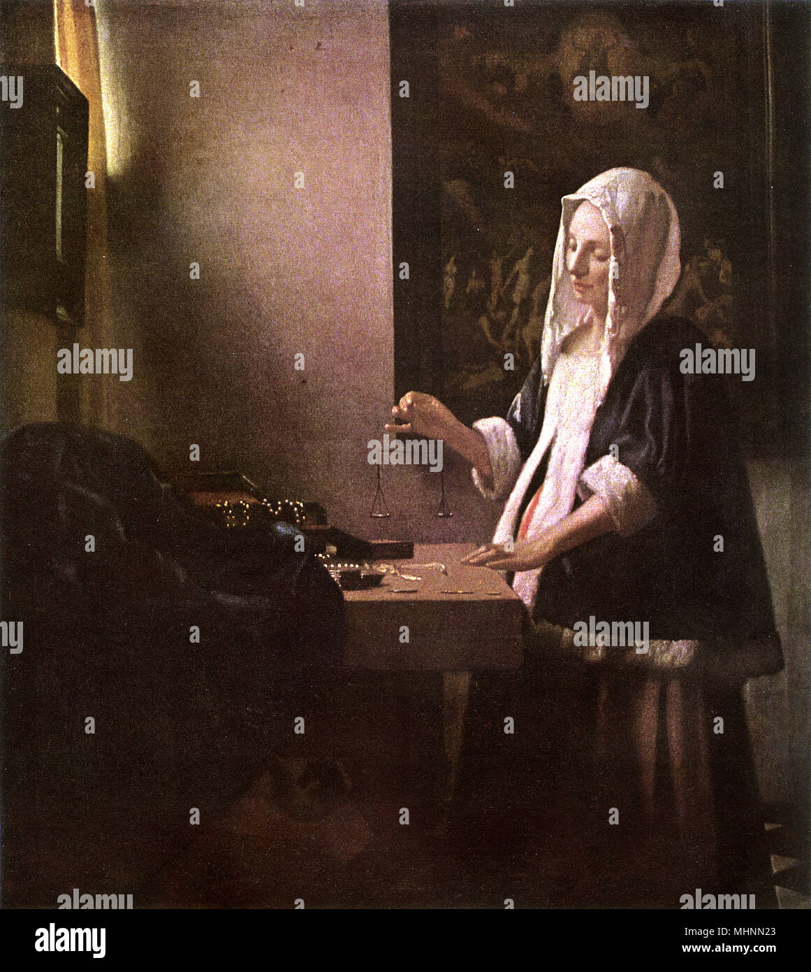 Woman Weighing Gold, by Johannes Vermeer Stock Photo