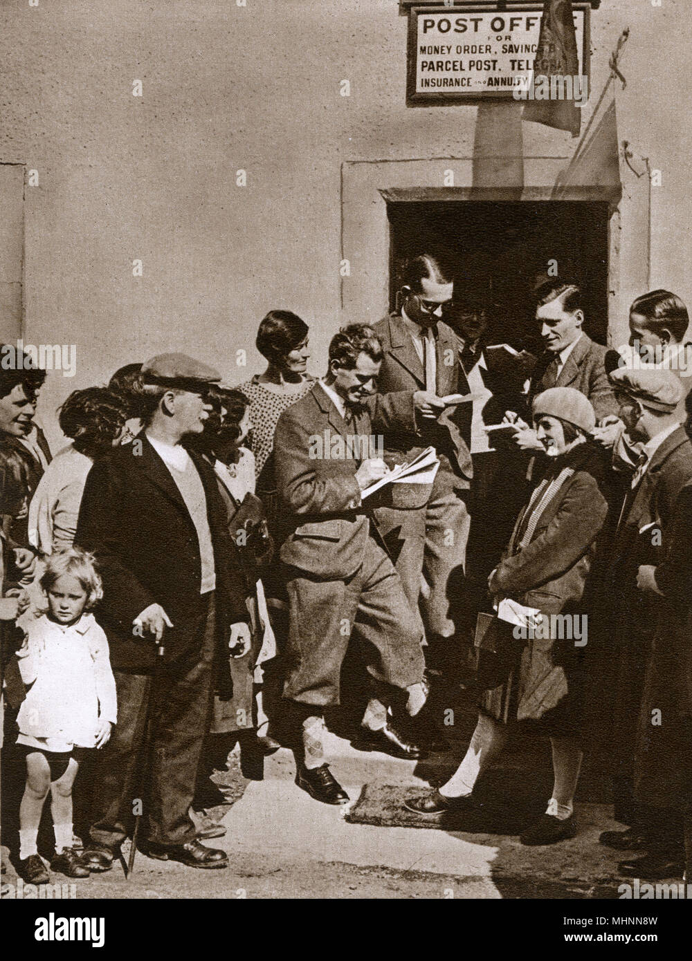 Birth of Princess Margaret - Interested villagers of Glamis gathering outside the post Office to see/read the first bulletin. The doctor's notification read: &quot;The Infant Princess is doing fine.&quot;     Date: 1930 Stock Photo