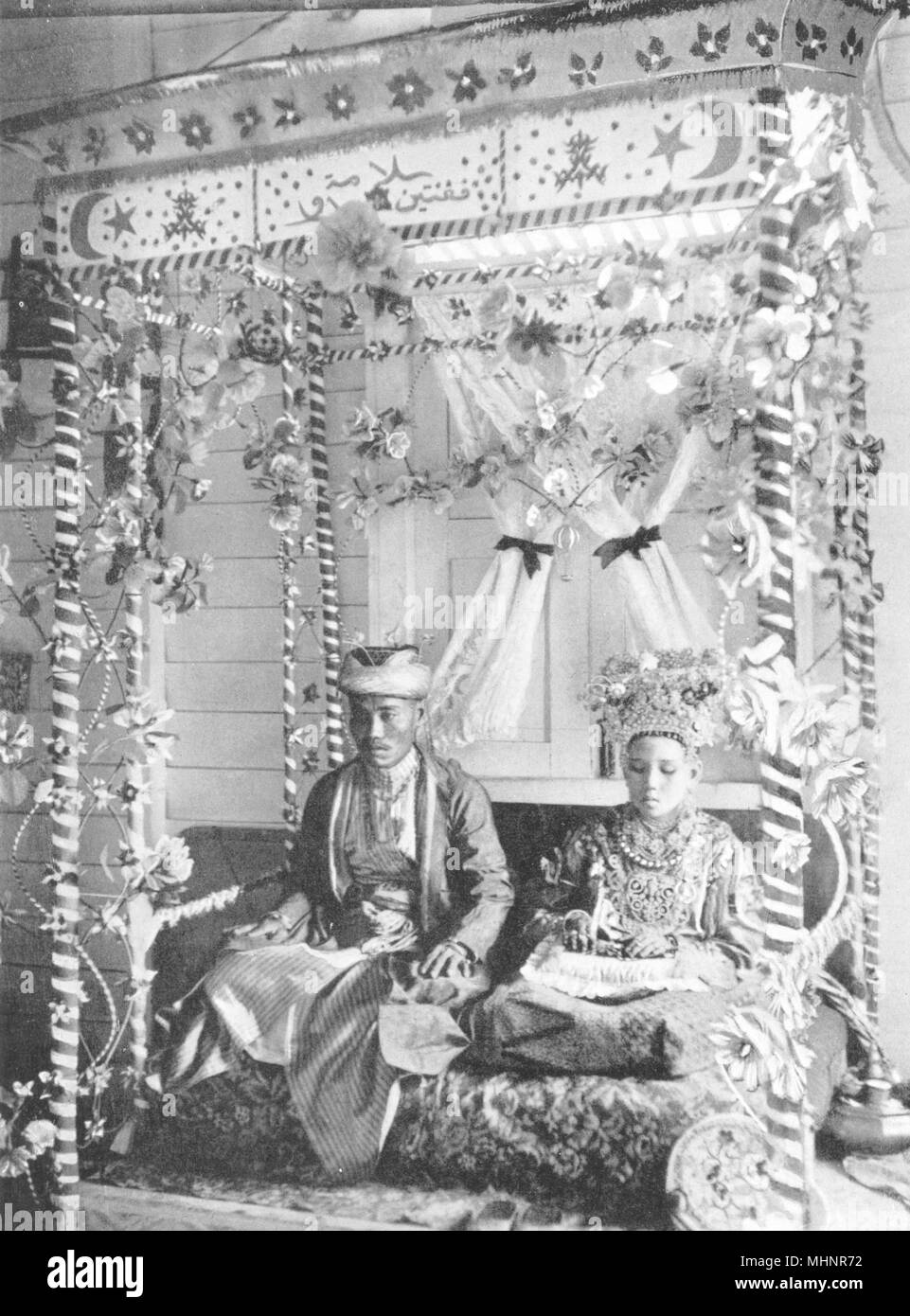 MALAYSIA. Enthronement ceremony Malay wedding;Bersanding(homage 1-day King) 1900 Stock Photo