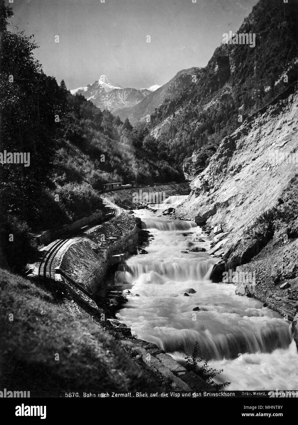 The Visp-Zermatt Railway Line by River Rhone, Switzerland Stock Photo
