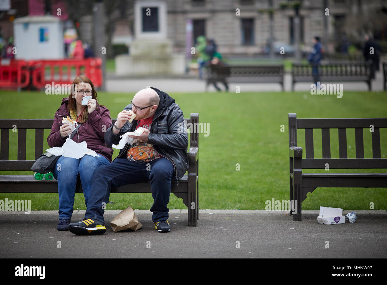 Glasgow in Scotland,  snacking in George Square Stock Photo