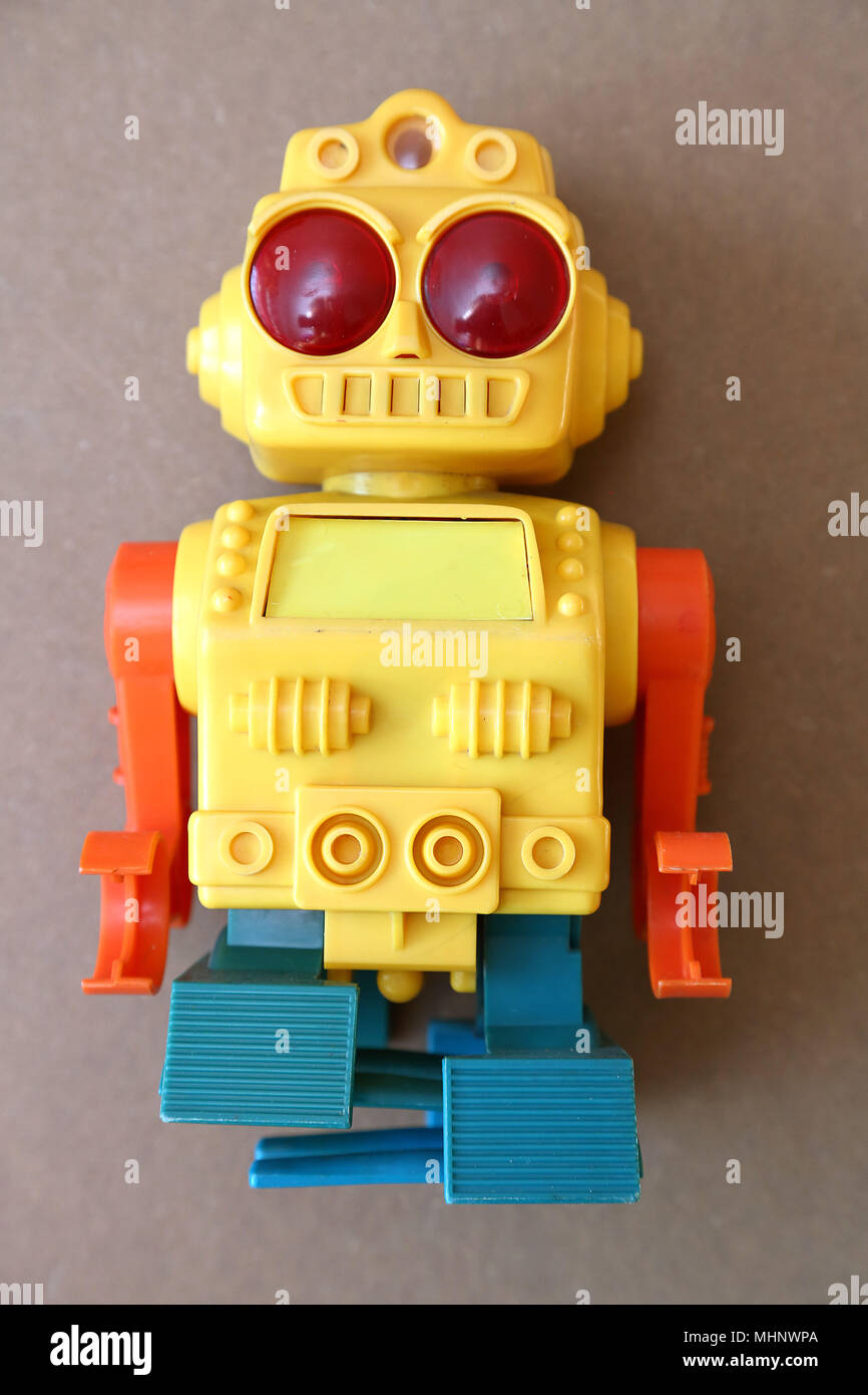 Retro Toy Walking Plastic Robot - Yellow Body (1/3) Stock Photo