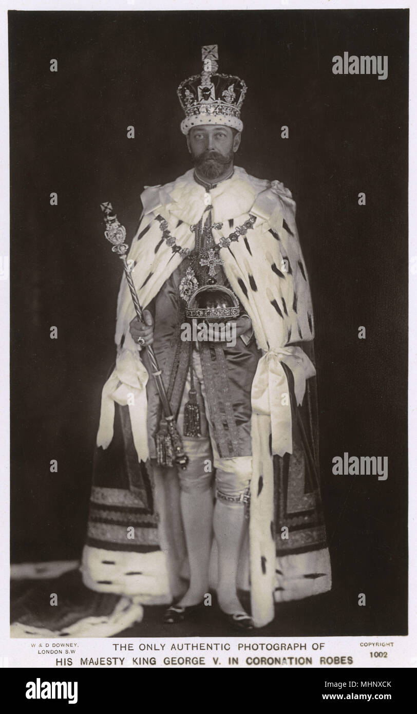 King George V in coronation robes, holding the orb and sceptre.      Date: 1911 Stock Photo