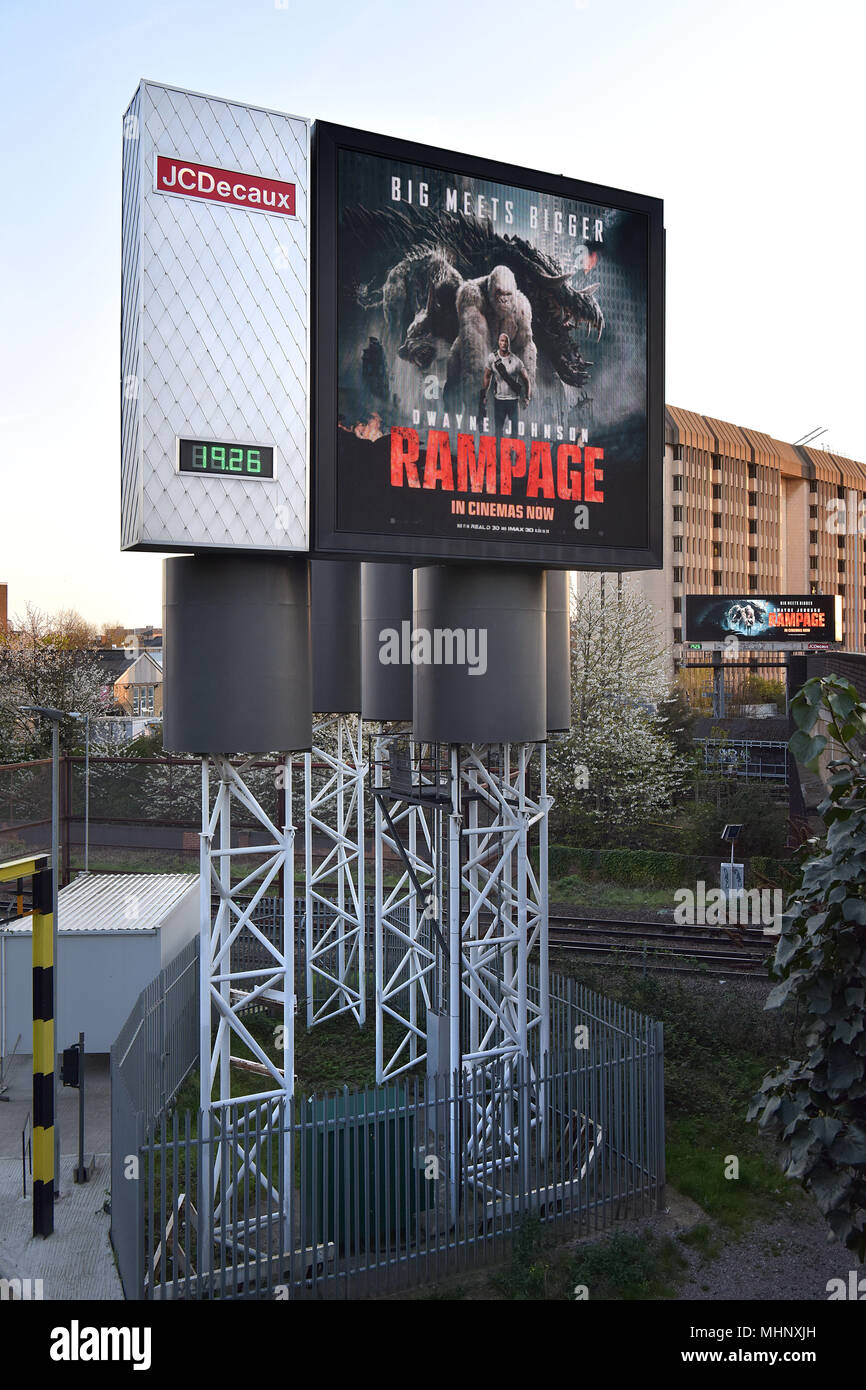 Digital advertising hoardings promoting the film Rampage on the Talgarth Road, Fulham  in West London, UK. Stock Photo