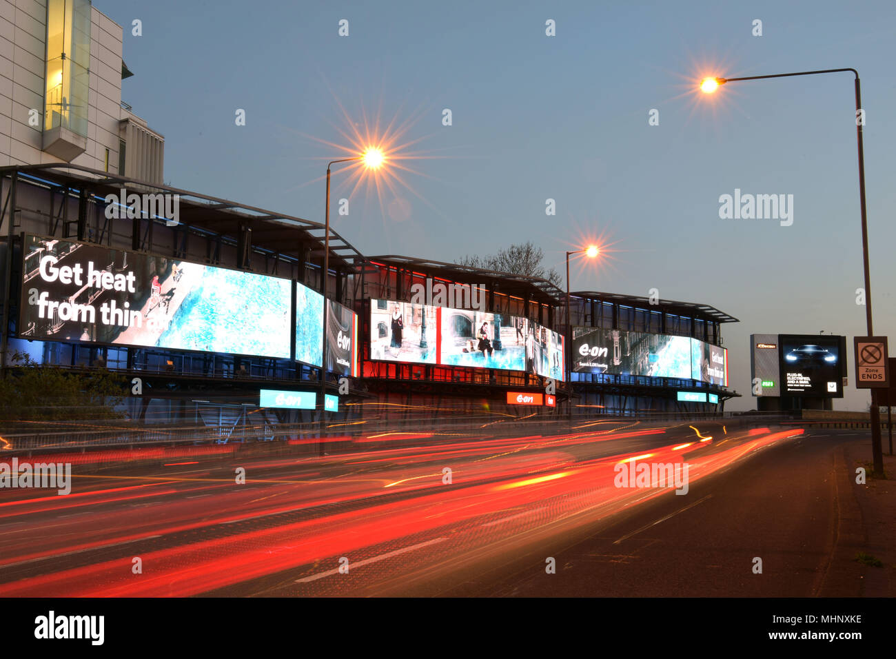 Digital advertising hoardings promoting the domestic energy company E-on on the Talgarth Road, Fulham  in West London, UK. Stock Photo