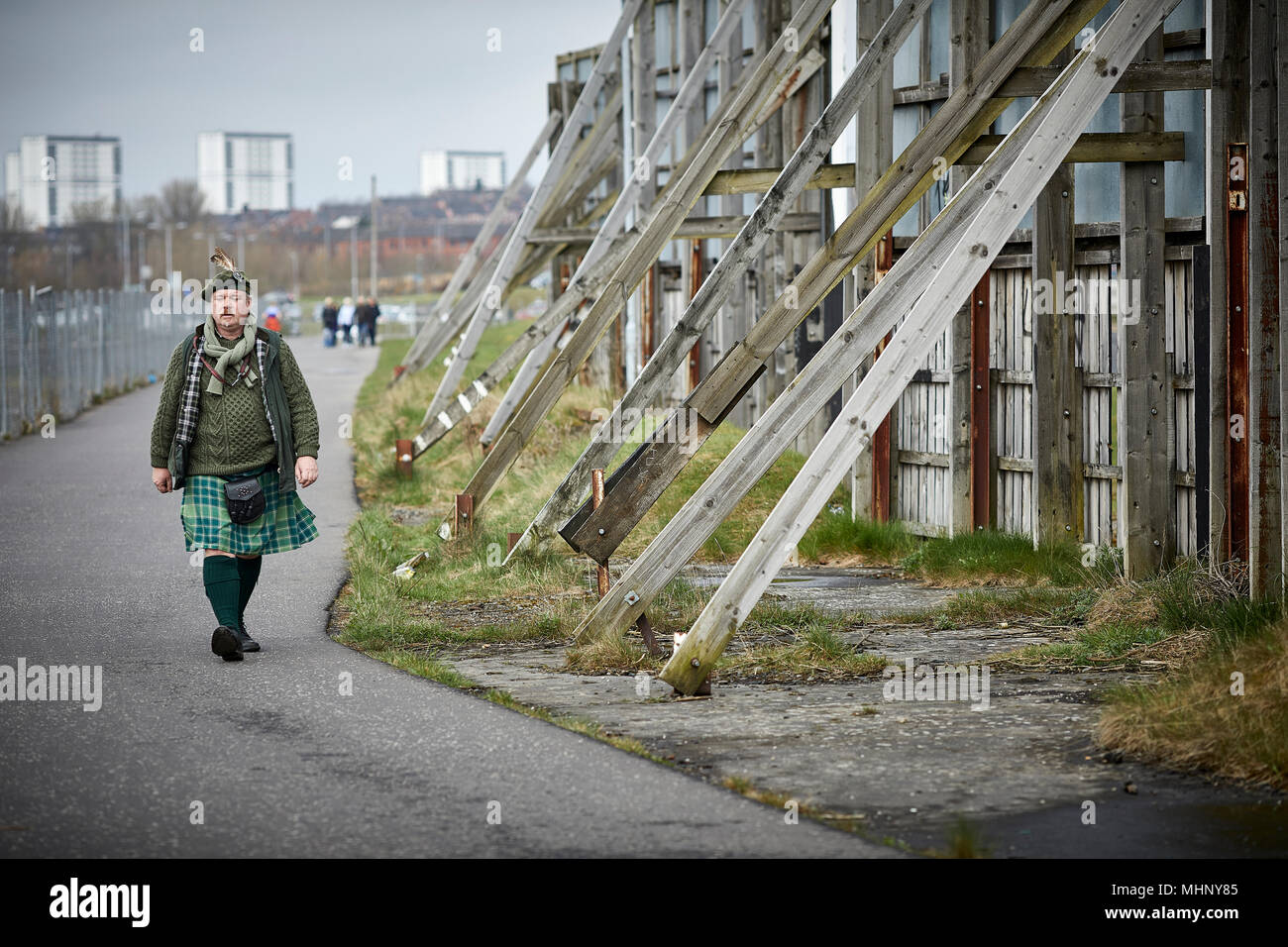 Glasgow in Scotland,  Kilt wearing gent walking alone the River Clyde Stock Photo