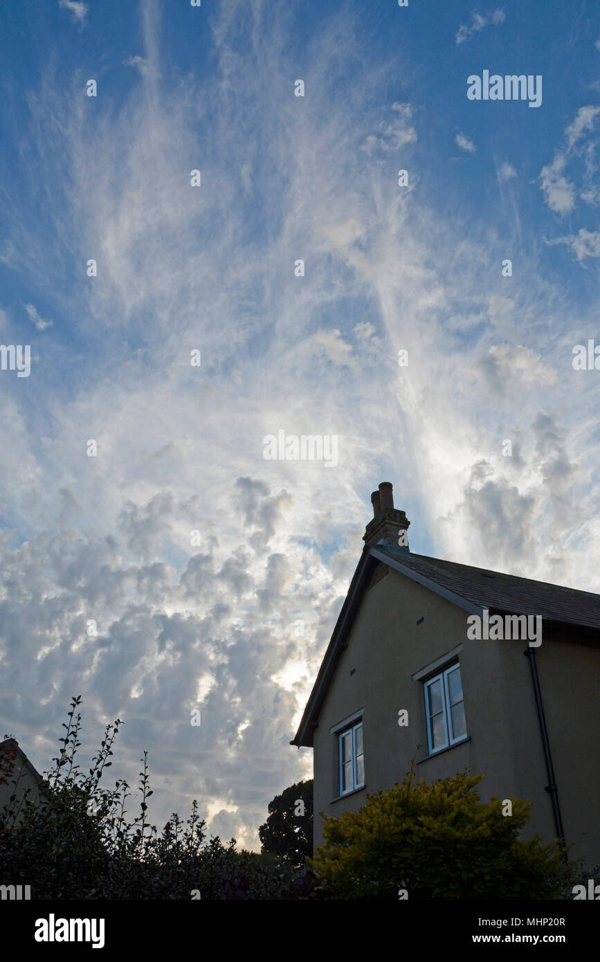 altocumulus and cirrus cloud above Bradninch in Devon Stock Photo