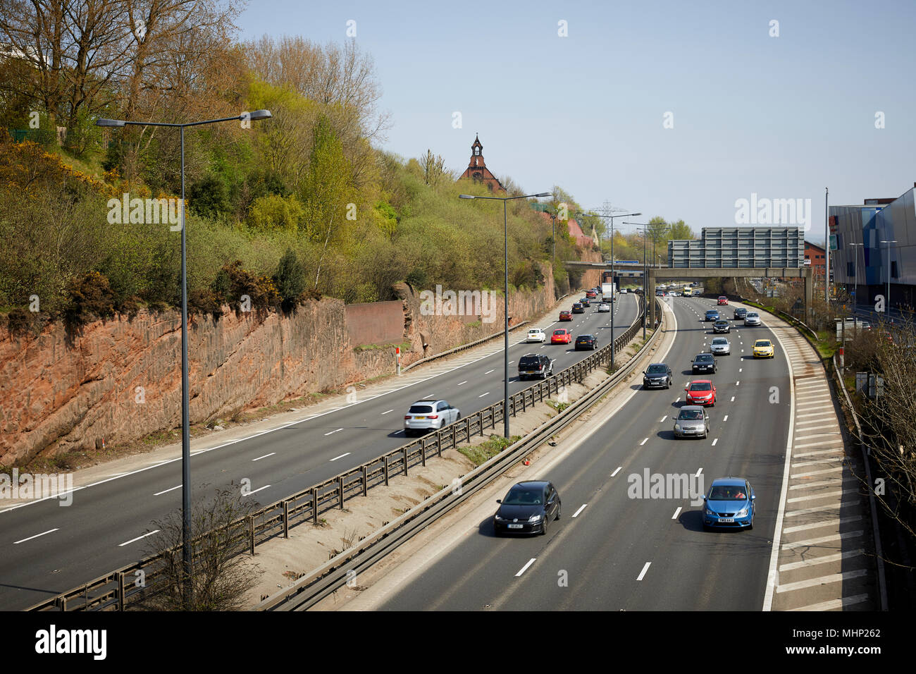 M60 orbital motorway passes Stockport town centre cutting through he towns sandstone in Cheshire Stock Photo