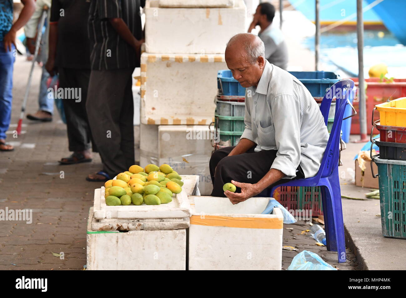 MALE, MALDIVES - MARCH, 4 2017 -  People buying fruit and vegatbles at island market Stock Photo