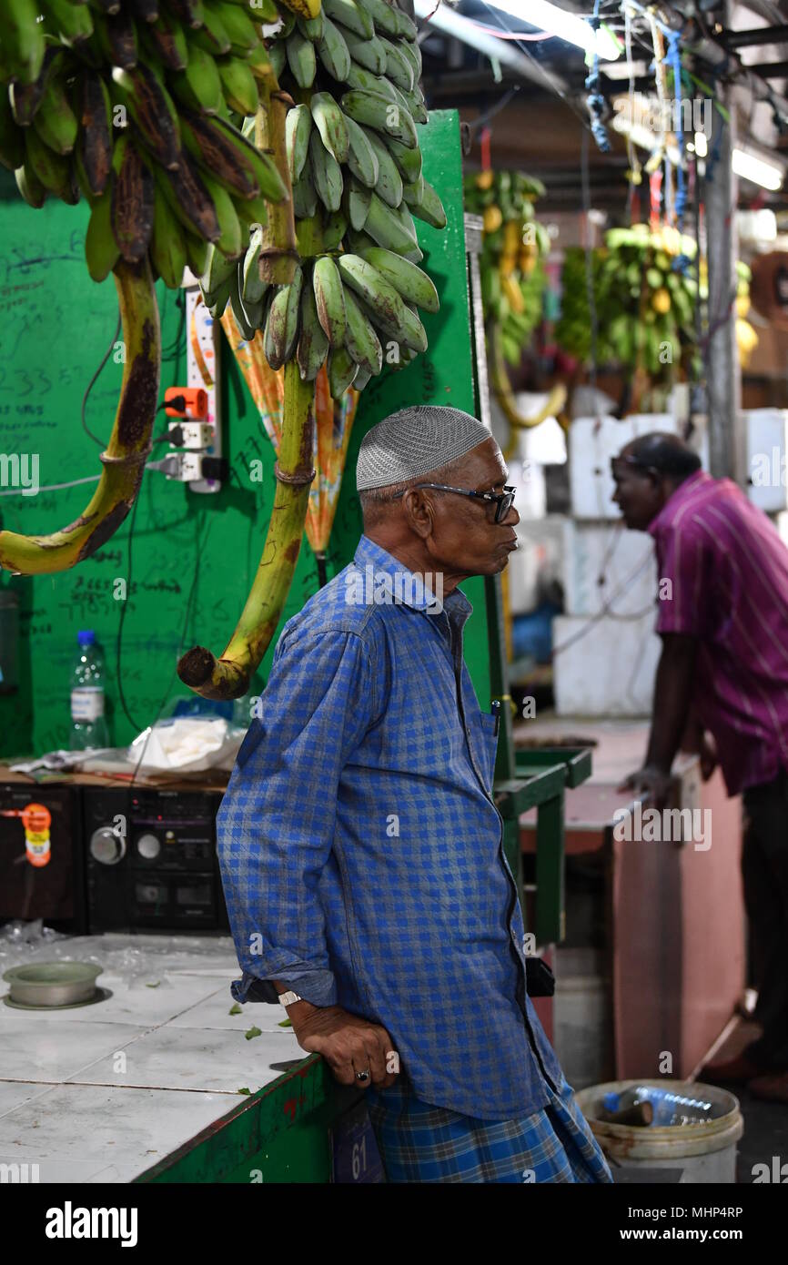 MALE, MALDIVES - MARCH, 4 2017 -  People buying fruit and vegatbles at island market Stock Photo