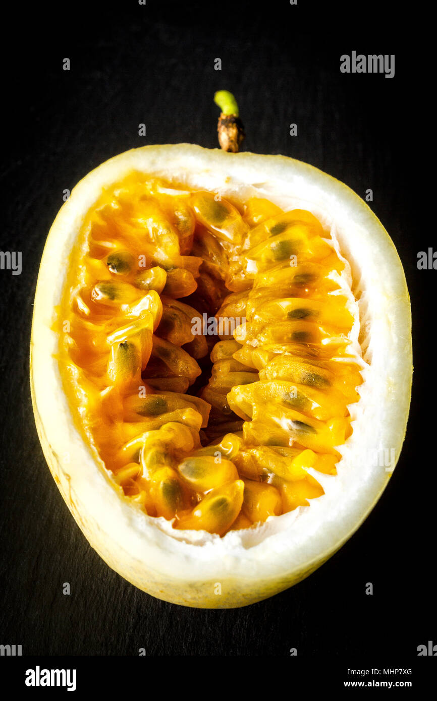 Passion fruit cut in half Stock Photo Alamy