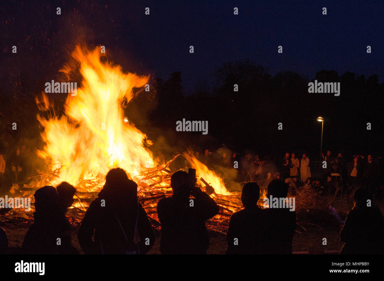 Stockholm, Sweden - April 30 2018. People celebrating walpurgis night, the coming of spring with a bonfire in the northern suburb of Stockholm, Akalla Stock Photo