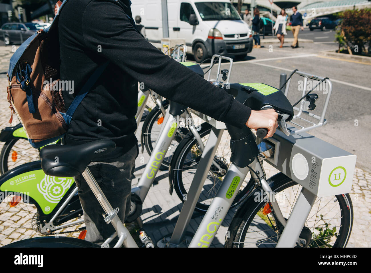 Portugal, Lisbon 29 april 2018: city bicycles or alternative ecological public transport. A person takes a bicycle for rent. Stock Photo