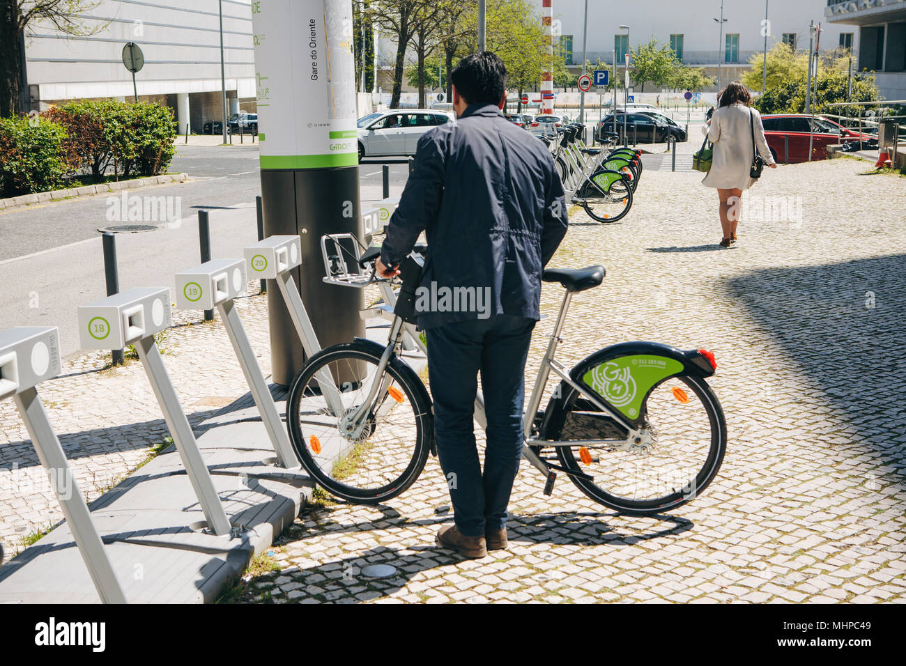 Portugal, Lisbon 29 april 2018: city bicycles or alternative ecological public transport. A person takes a bicycle for rent. Stock Photo