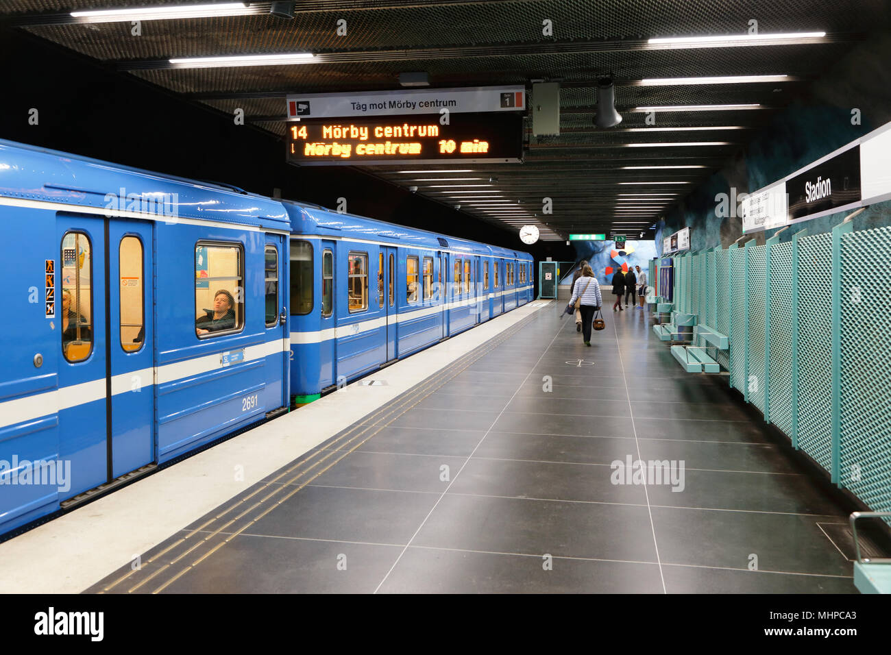 Stockholm, Sweden April 23, 2014: A blue metro train with closed doors on line 14 towards Morby center is ready for departure fromthe undrground stati Stock Photo