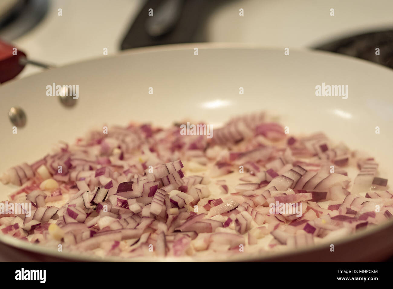 Chopped Red Onion In Frying Pan Stock Photo Alamy