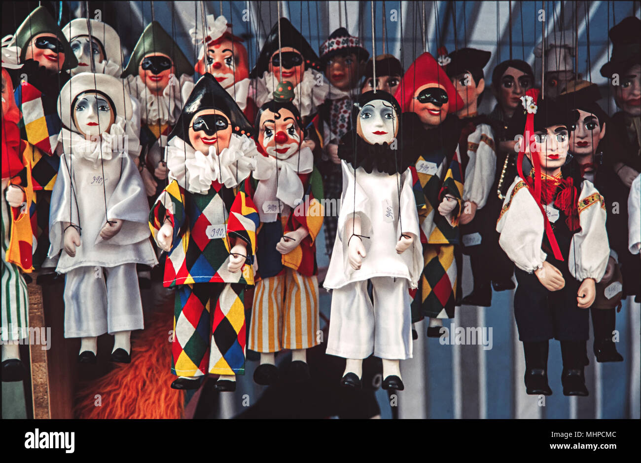 Venetian handcraft puppets in market. Traditional puppets for sale in souvenir shop Stock Photo