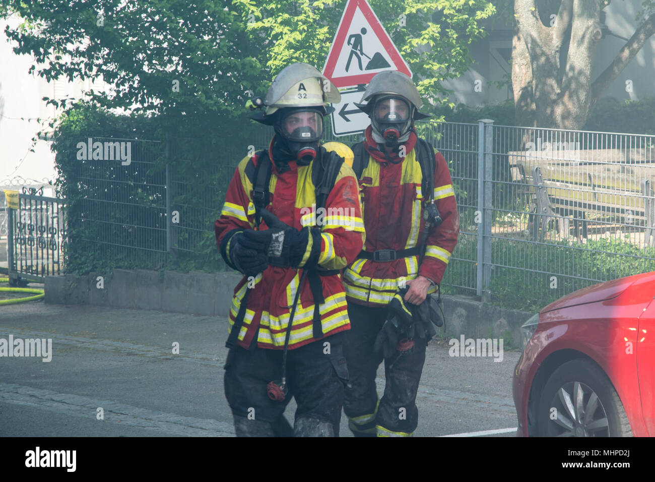 two Fireman with equipment Stock Photo