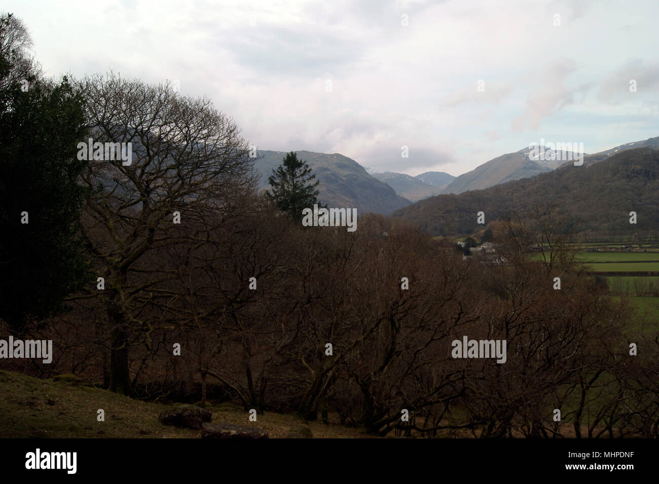 From a high viewpoint looking across the Borrowdale valley towards the distant high Fells Stock Photo