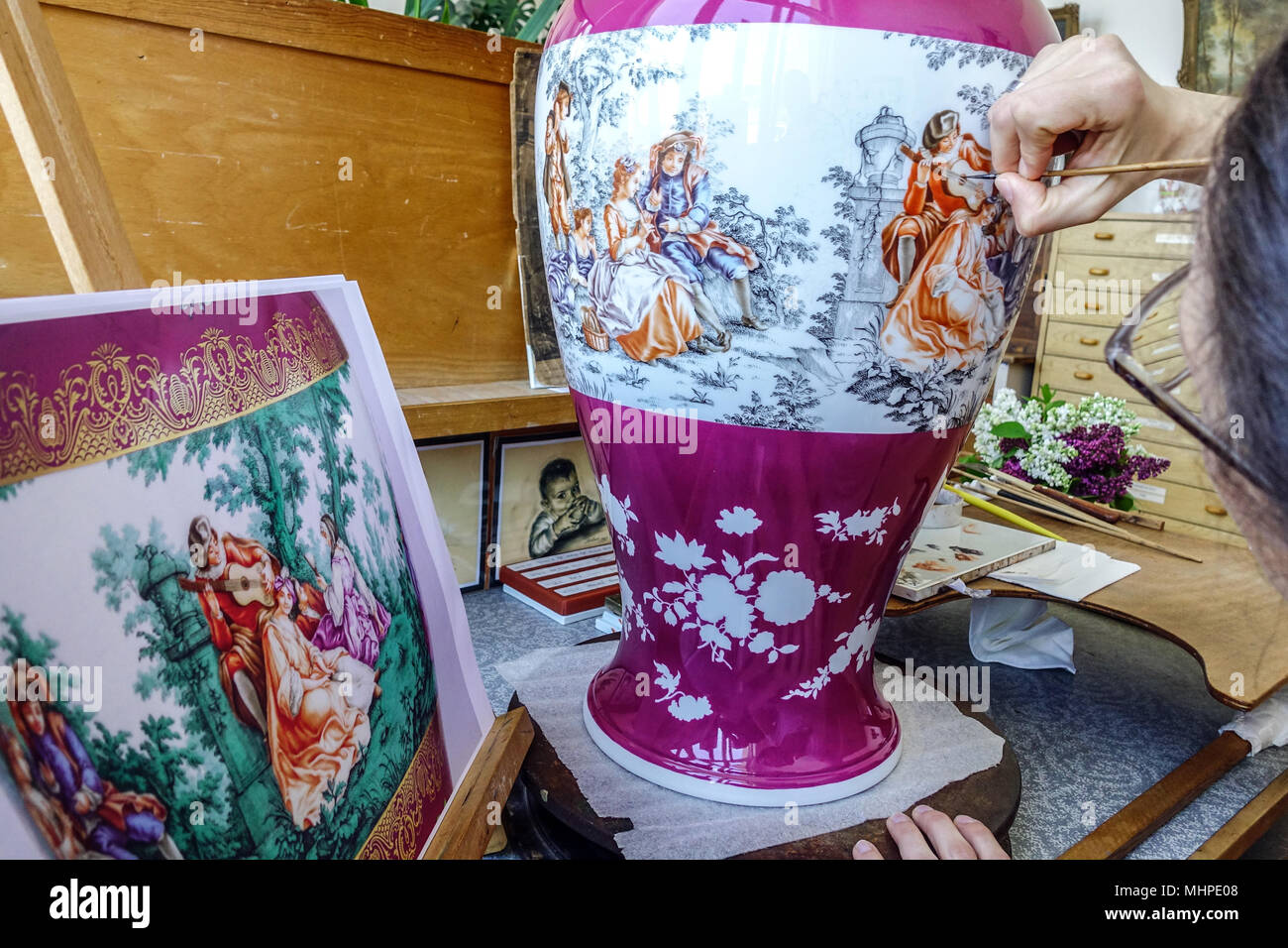 Meissen porcelain factory, woman painting onglaze porcelain Meissen