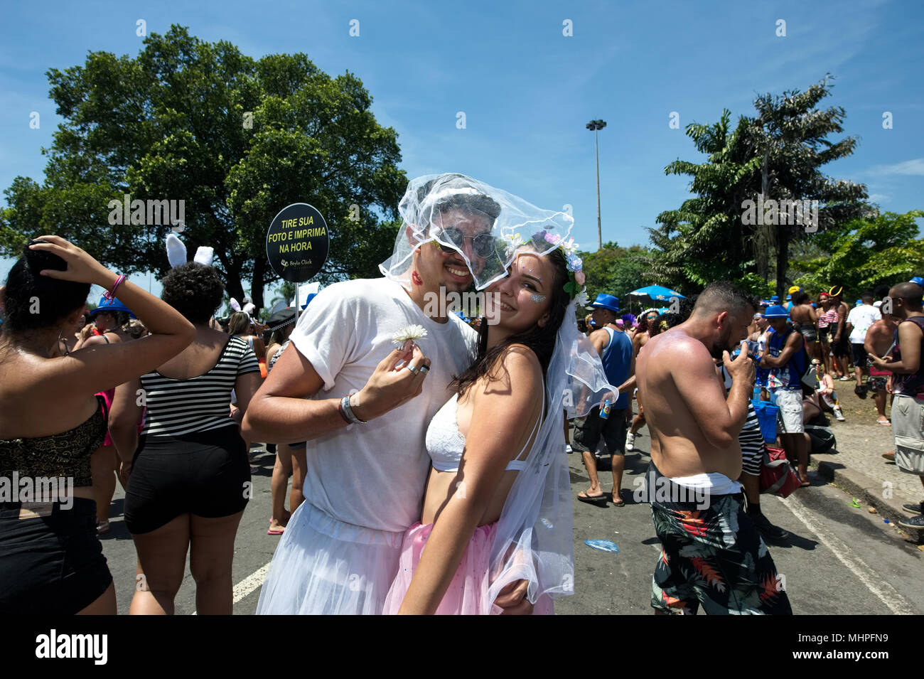 Rio de Janeiro, Brazil - February 11, 2018: Young Brazilian revelers smile for the camera at a carnival street party Stock Photo