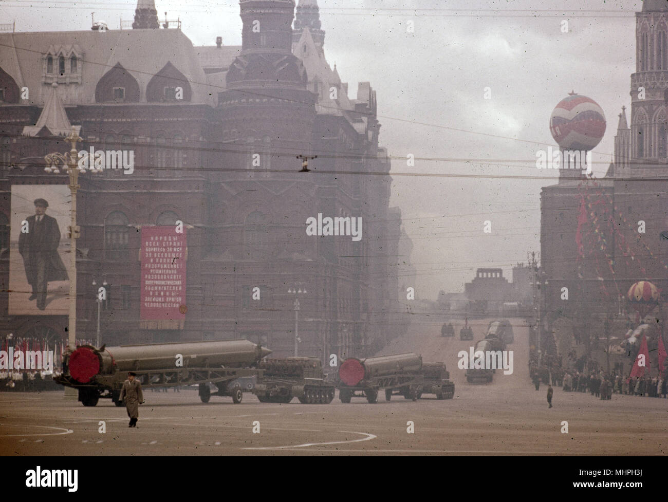 Street scene during the May Day celebrations in Red Square, Moscow, in 1961 -- military parade of vehicles and missiles.     Date: 1961 Stock Photo