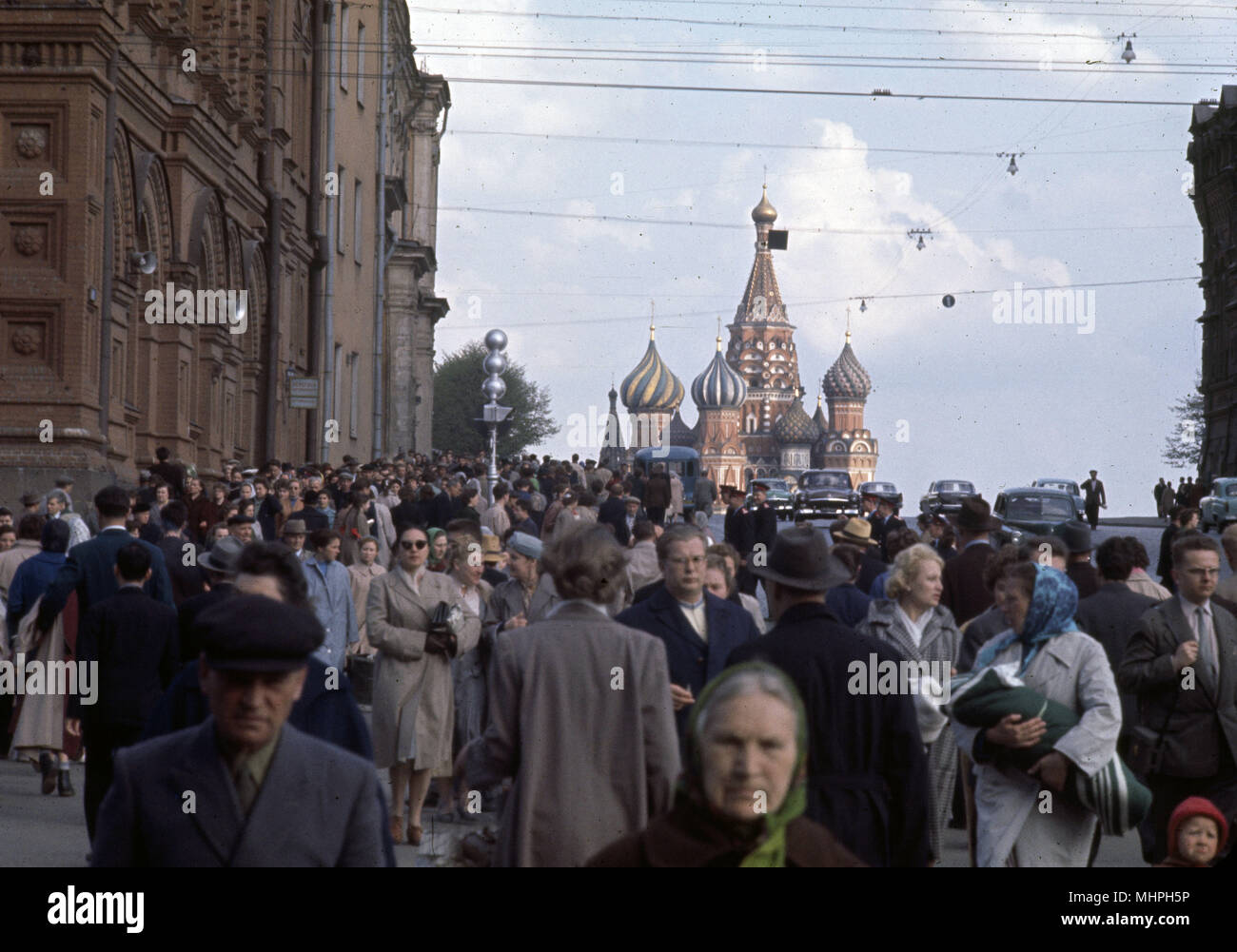 People in the street, Red Square, Moscow, USSR, with St Basil's Cathedral in the background.      Date: circa 1960s Stock Photo