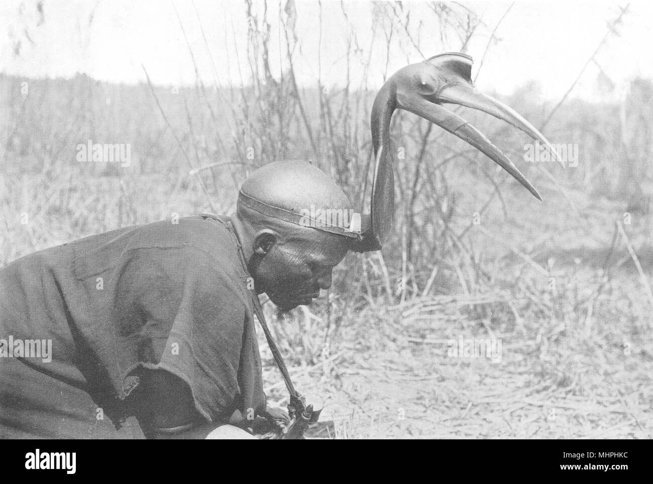 NIGERIA. A Northern Nigerian Hunter; stalking game. Nupe hornbill 1900 print Stock Photo